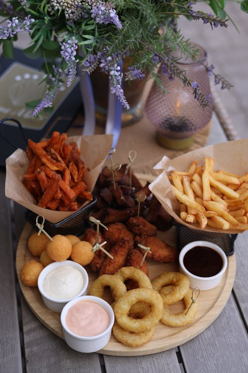 A wooden tray with a variety of food on it
