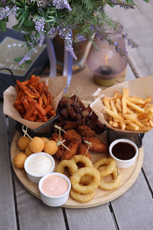 A wooden tray with a variety of food on it