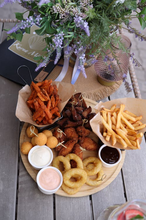 A table with a plate of food and drinks