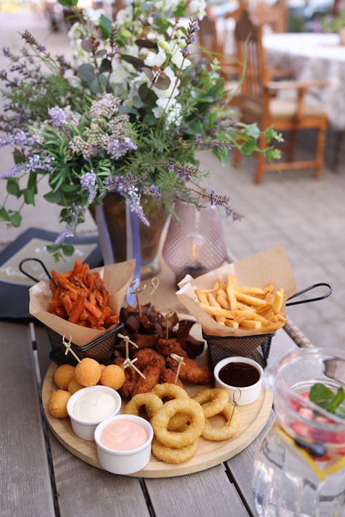 A table with a variety of food and drinks