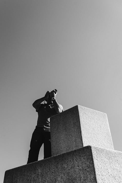 Free Monochrome Photo of Man Using His Camera Stock Photo