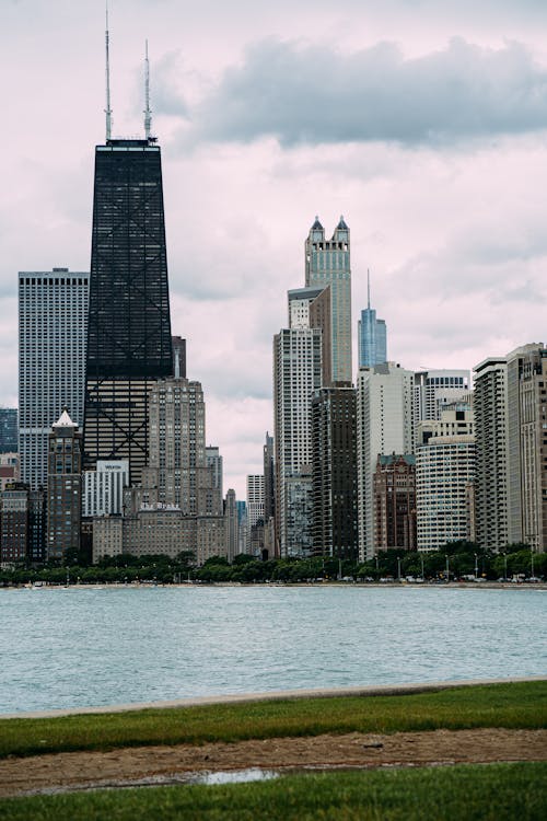Free Photo of City Buildings Under Cloudy Sky Stock Photo