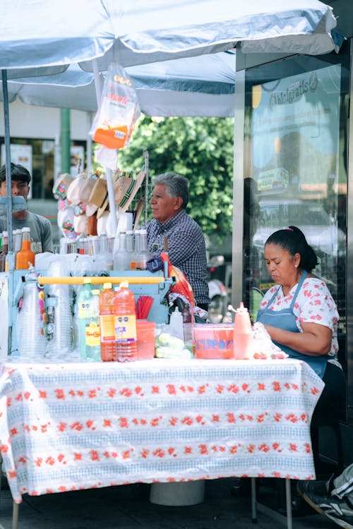 A woman is selling food at a market