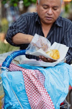 Street vendor in Mexico City preparing a traditional snack with care.