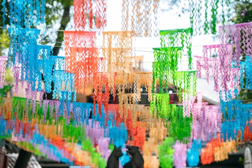 Colorful paper streamers hanging from a tree