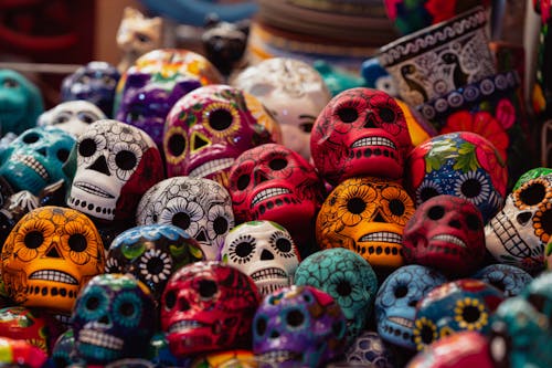A pile of colorful skulls on display