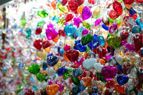A wall covered in colorful glass hearts