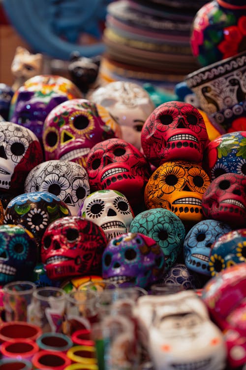 A pile of colorful skulls on display