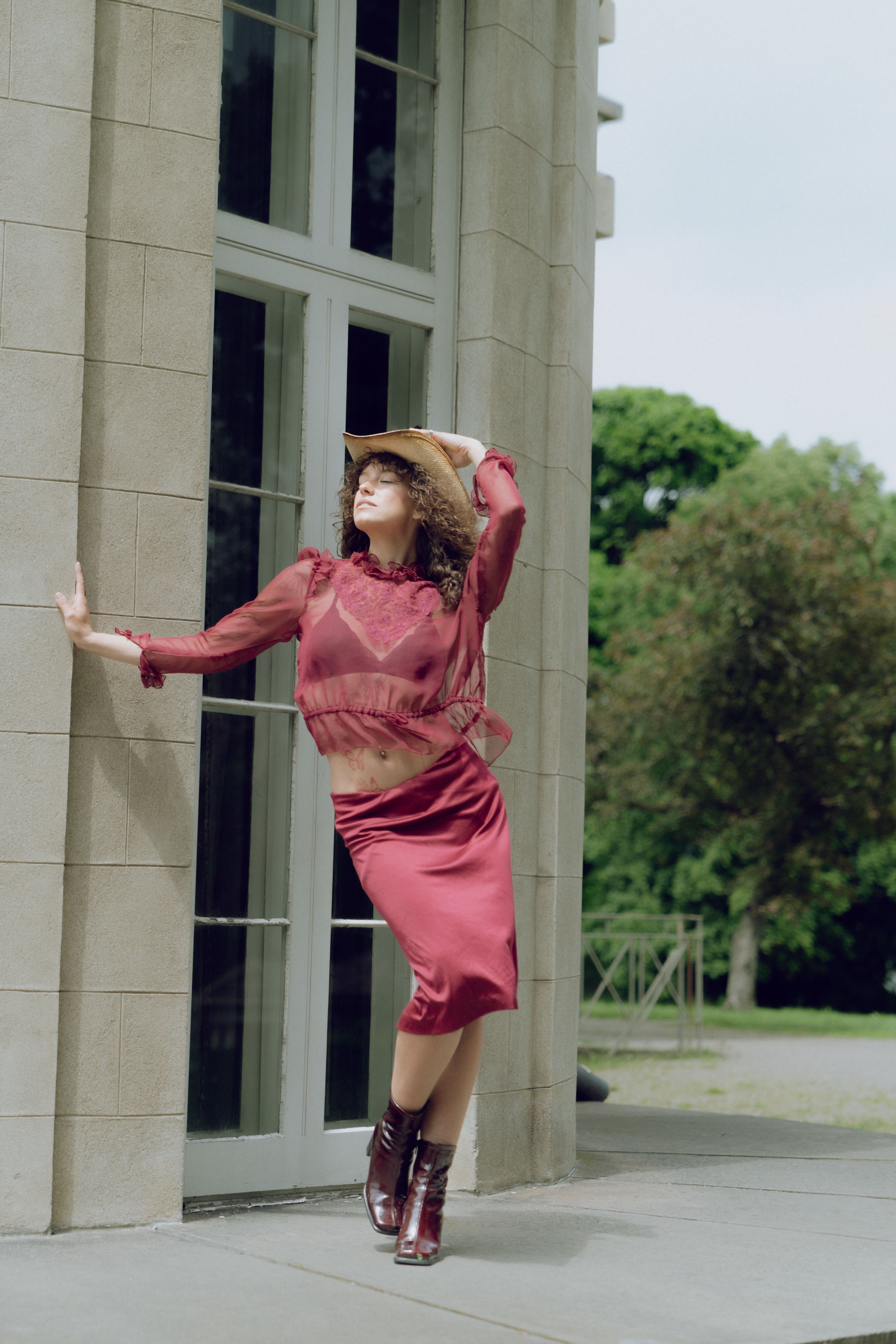 A woman in a red dress is jumping up and down · Free Stock Photo