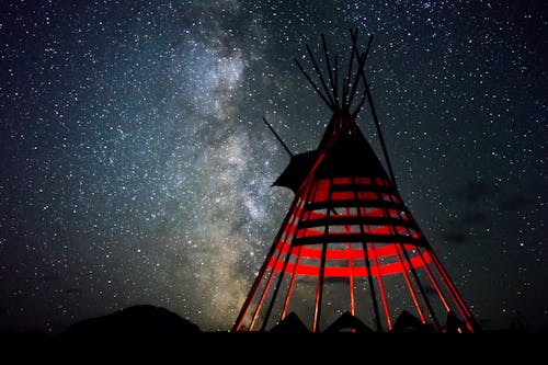 Free Red and Black Indian Hut Under Star Sky Stock Photo