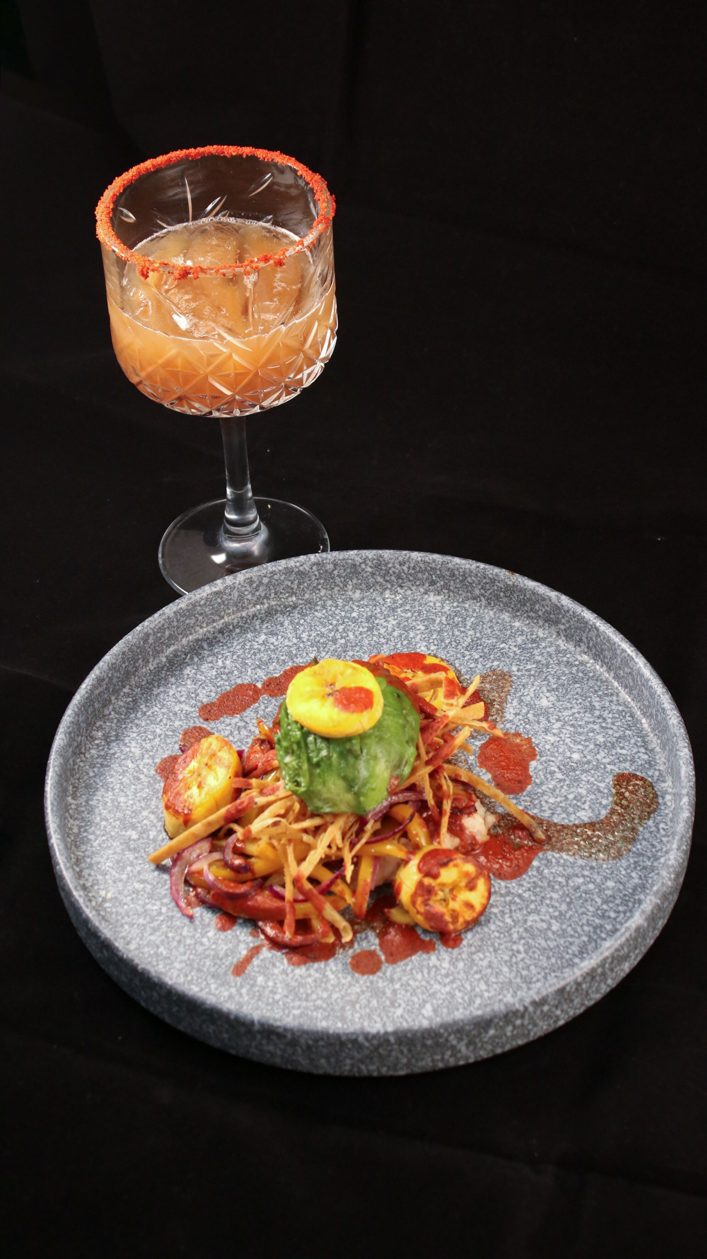 A plate with food and a glass of wine · Free Stock Photo