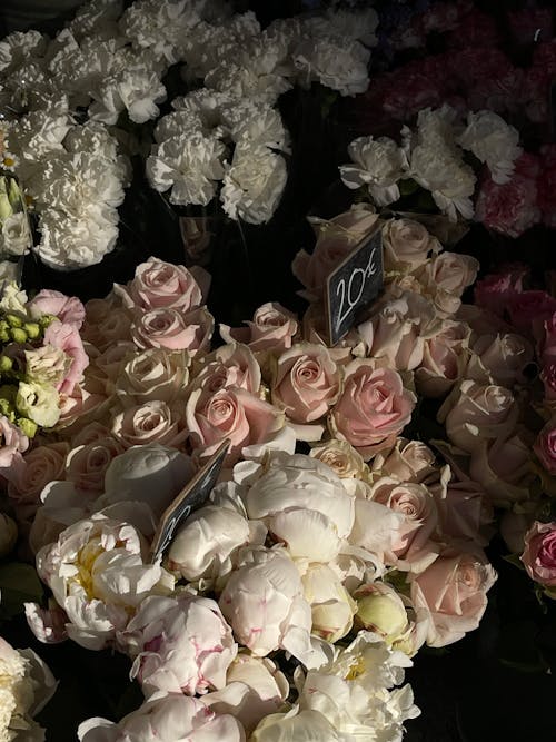 A bouquet of flowers is shown in a store