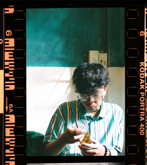 Photo of Man Holding Drinking Glass