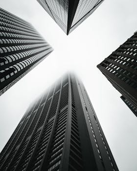 Dramatic low-angle shot of skyscrapers in Chicago creates a geometric urban scene.