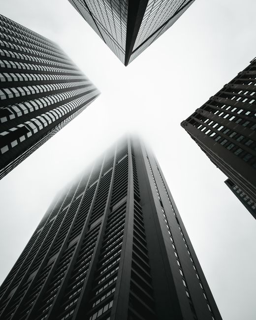 Dramatic low-angle shot of skyscrapers in Chicago creates a geometric urban scene.