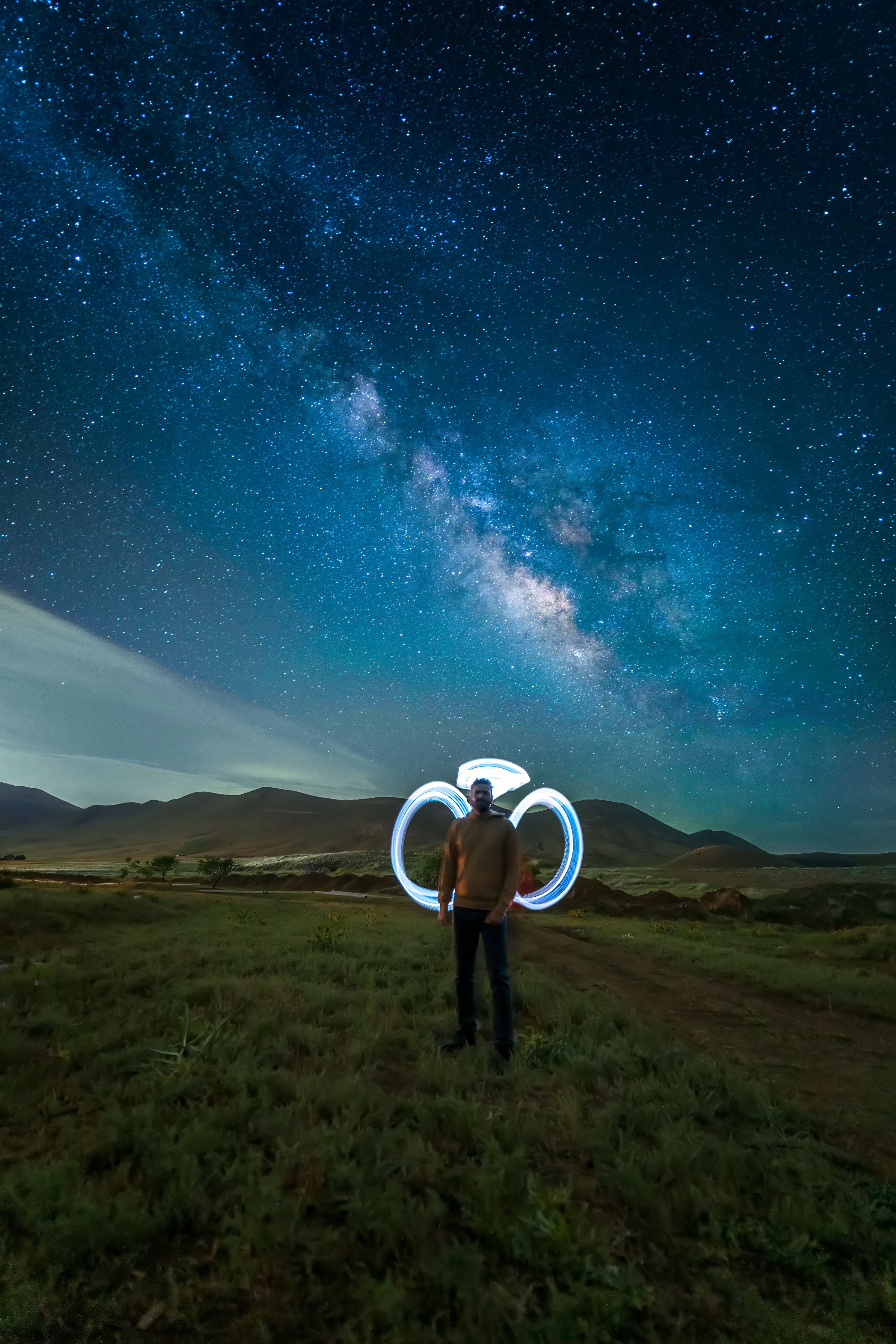 A Man Standing under a Starry Night Sky · Free Stock Photo