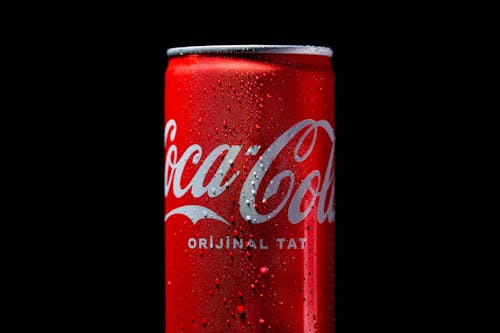 A can of coca cola on a black background