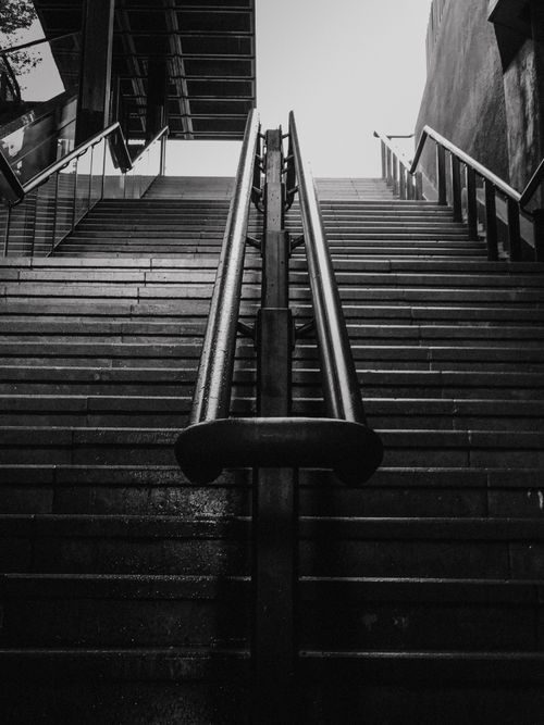 Free Black and white view of a metal staircase with handrails in Kuala Lumpur, Malaysia. Stock Photo