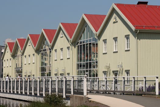 Symmetrical green houses with red roofs in Jonkoping, Sweden.