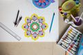 Mandala drawing on a workspace — photo by Ravi Kant on Pexels