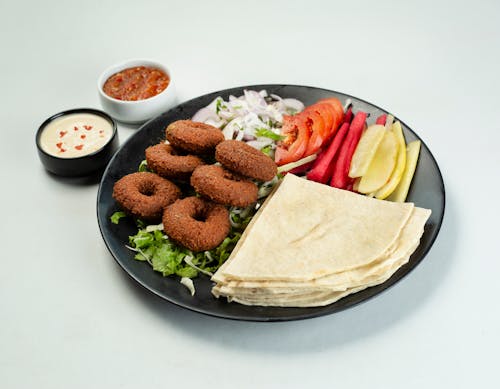 A plate with food on it and a fork