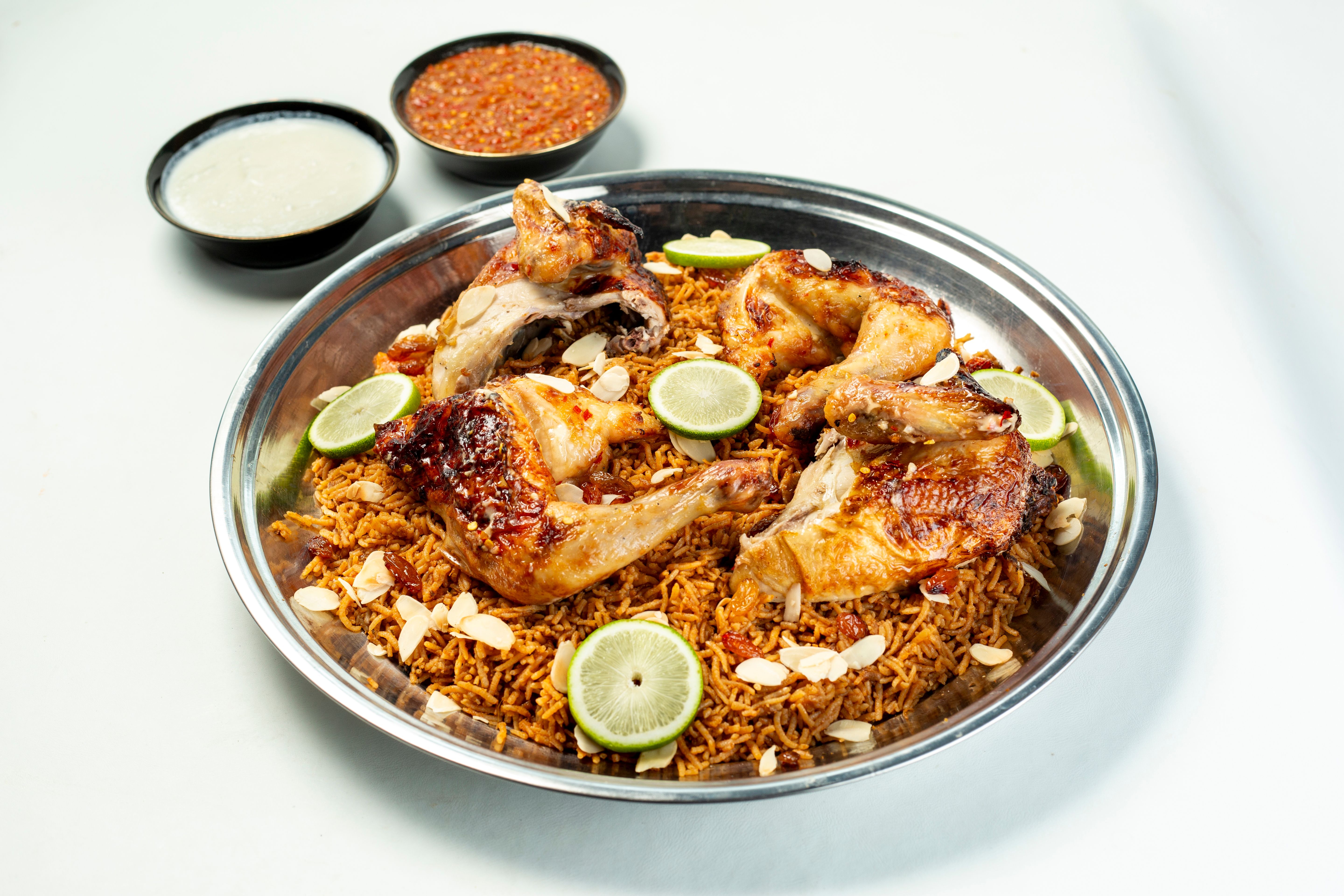 Spicy Suya beef skewers on wooden platter