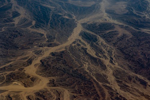 Aerial View of Road Between Mountains