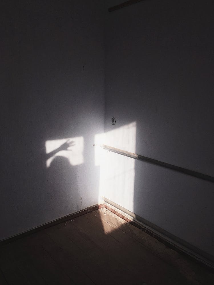 Shadow Of A Person On A White Wall