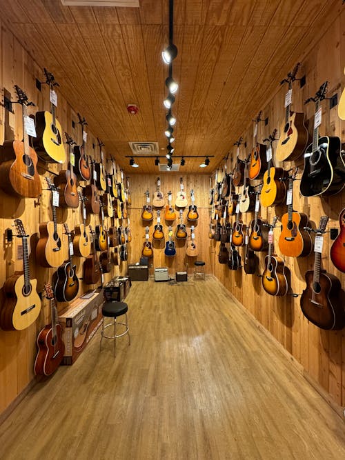 A guitar shop with many guitars on display