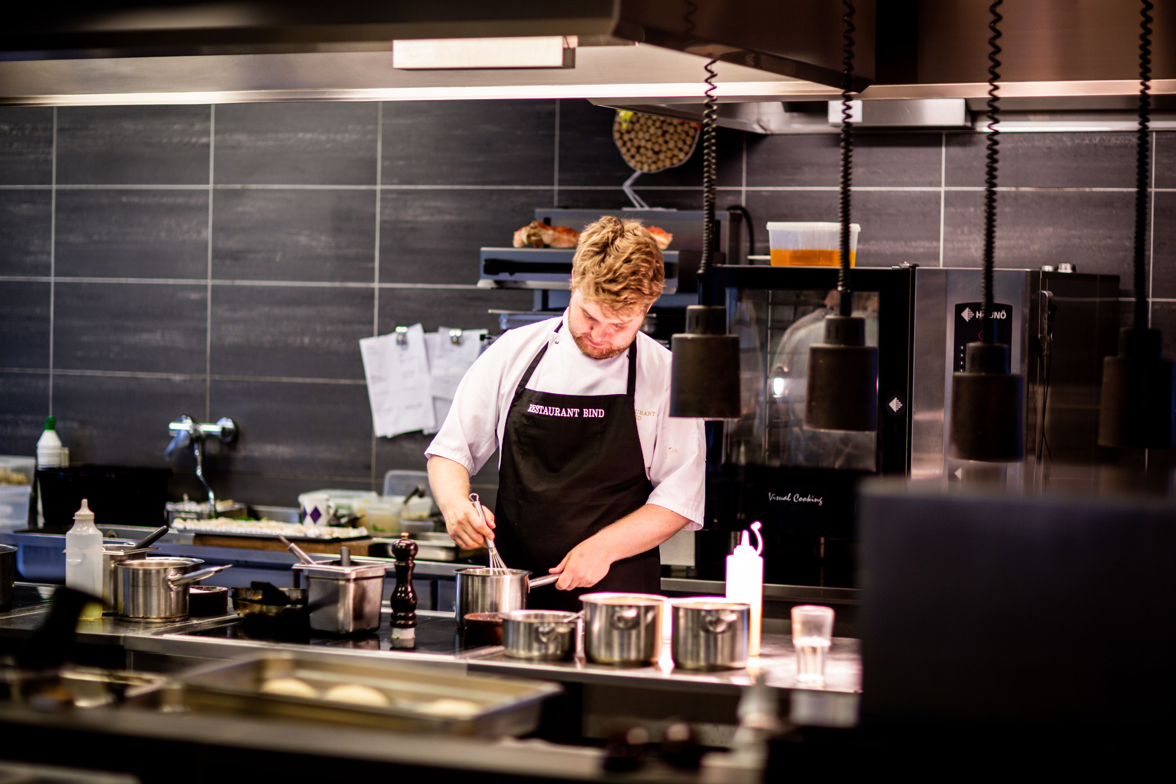 Chef Marin in whites at the pass