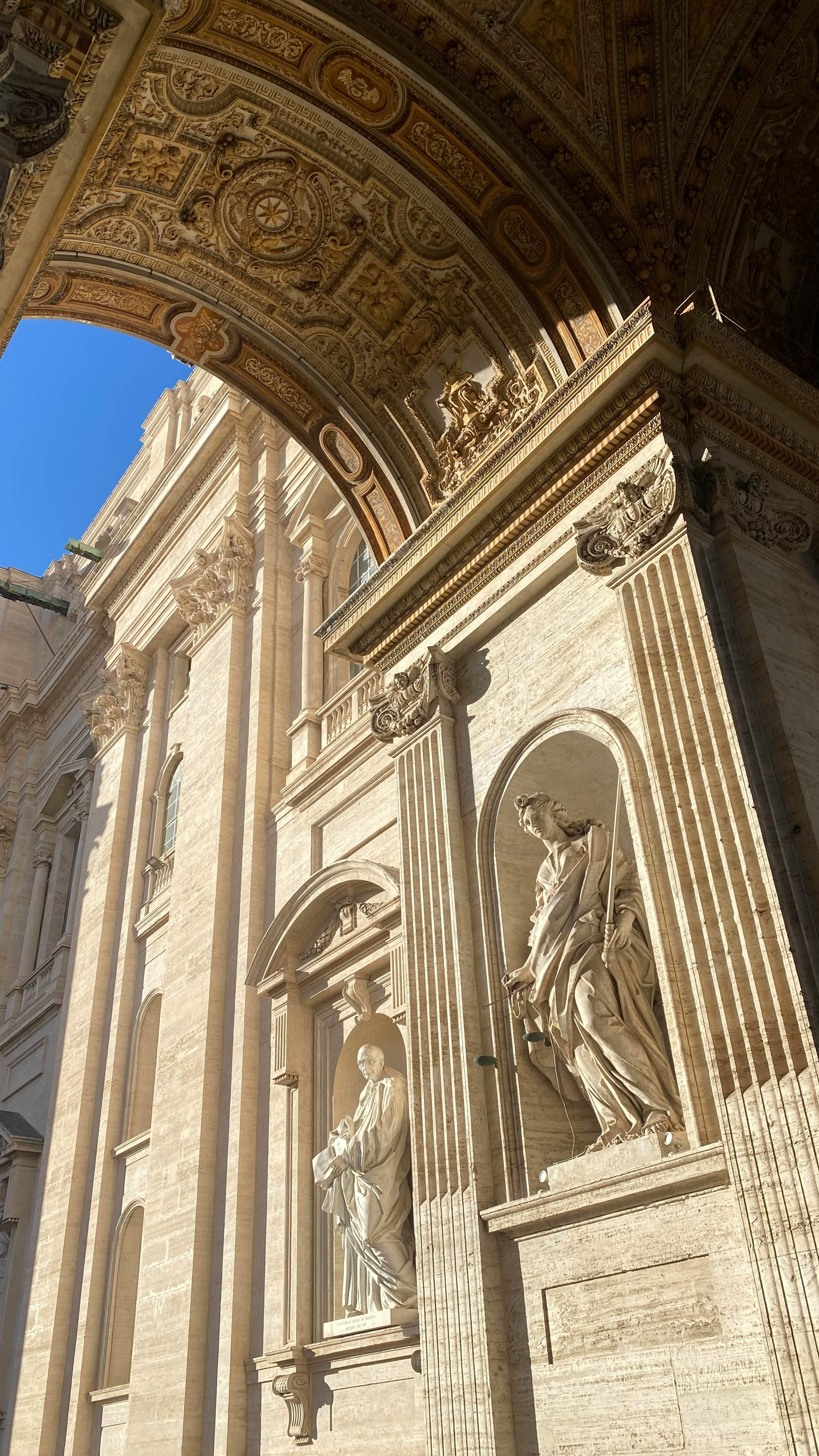 sculptures at wall near st peters square in vatican city