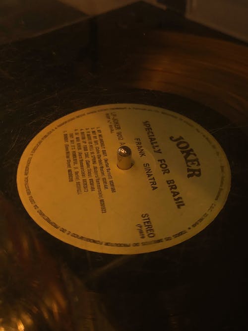 A gold record with a label on it