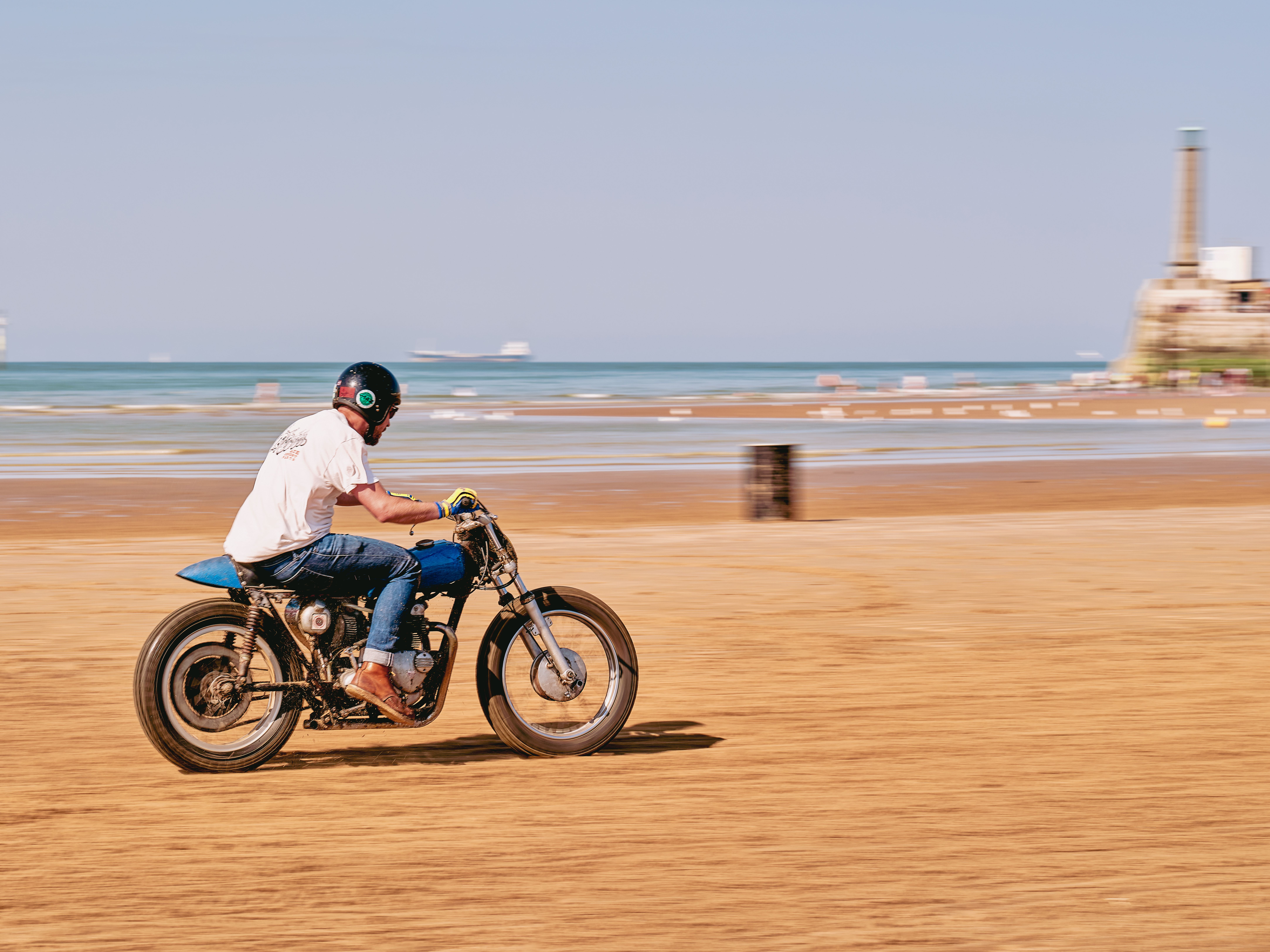 Man Riding Motorcycle along Sea · Free Stock Photo