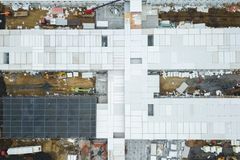 Drone shot capturing aerial view of a large construction site with unfinished buildings.