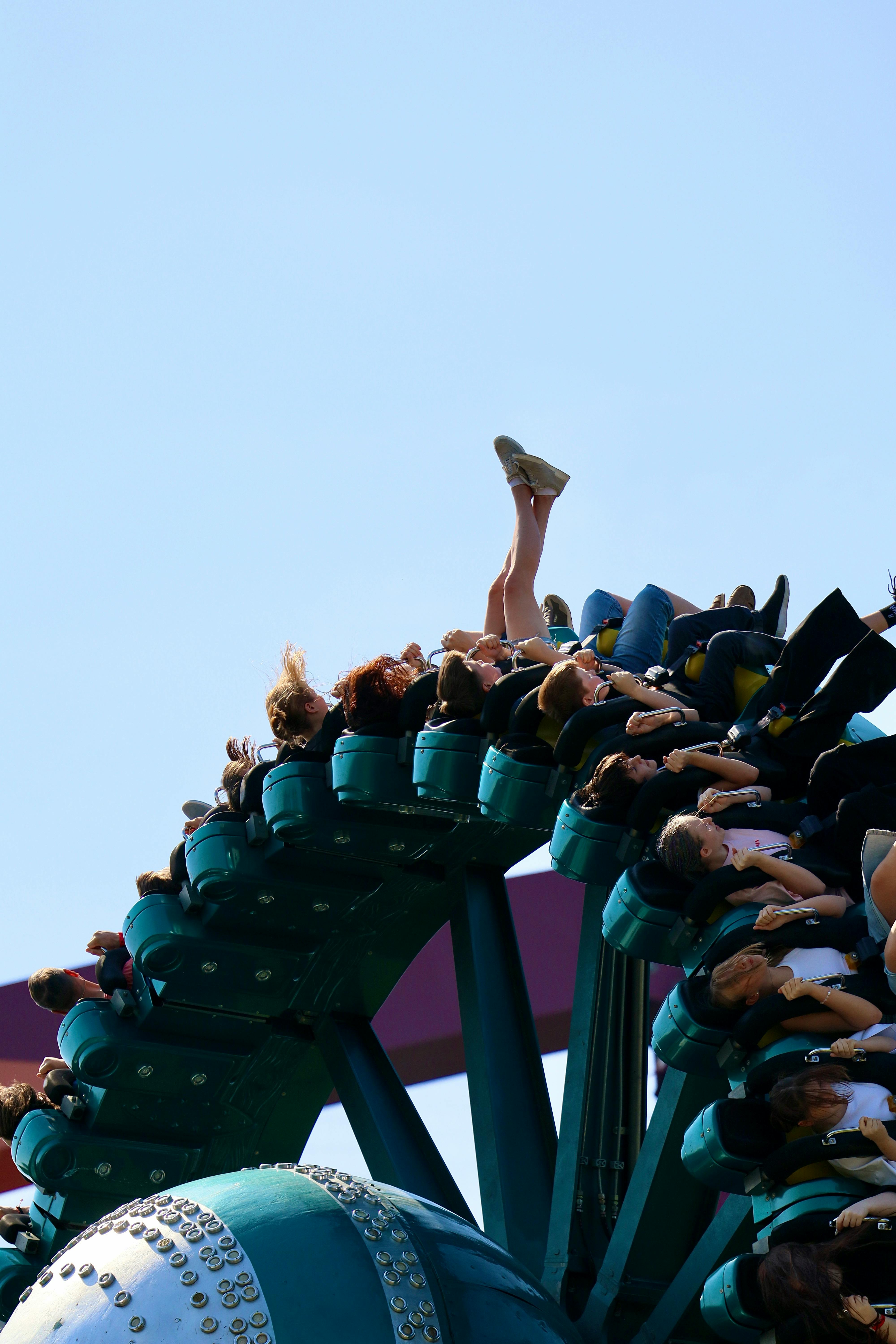 Exciting upside-down roller coaster experience filled with thrilling fun at a theme park.