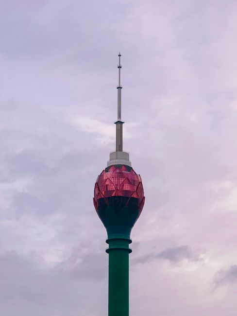 Captivating image of the Lotus Tower standing tall against a cloudy sky in Colombo, Sri Lanka.