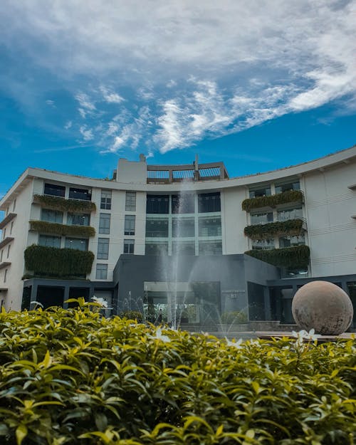 Architectural Photo of a White Building With a Fountain