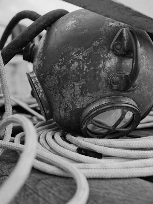 A black and white photo of a diving helmet