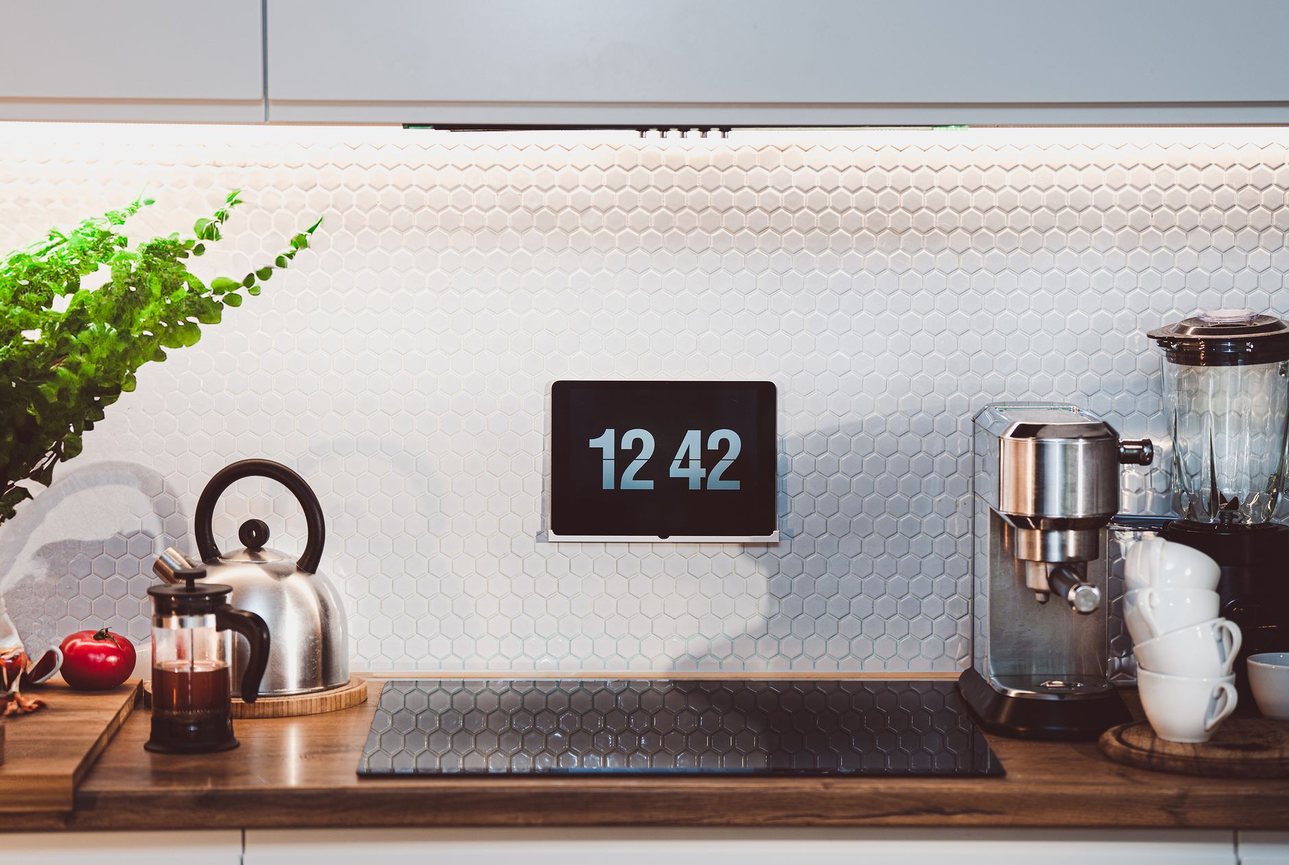 designer apartment decor with smart home gadgets Stylish kitchen interior with digital clock and coffee machine on counter.