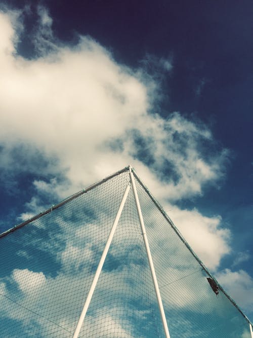 Low Angle View of Net Under Cloudy Sky