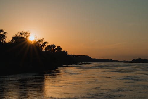 Foto profissional grátis de água, alvorecer, cair da noite