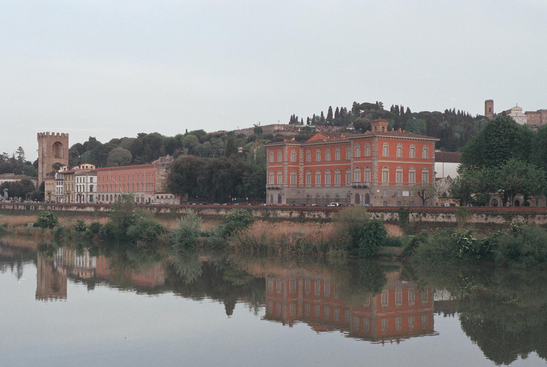 A picturesque view of Palazzo Serristori reflected in the Arno River, Florence, Italy.