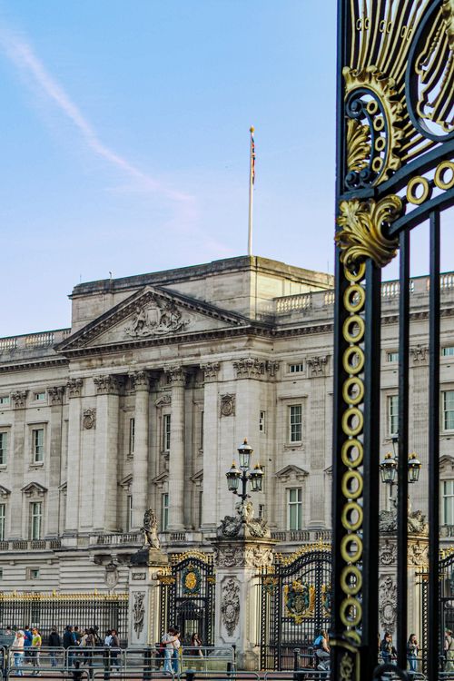 Free View of Buckingham Palace's stunning architecture and intricate gates, London, showcasing its historic grandeur. Stock Photo