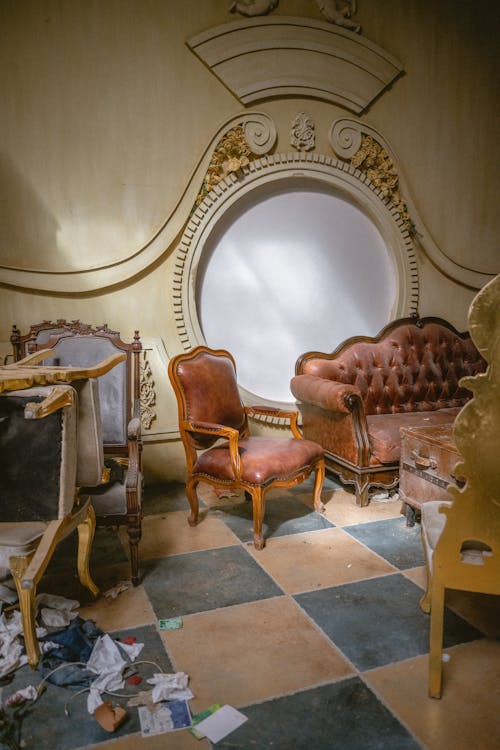 A room with a lot of furniture and a broken mirror