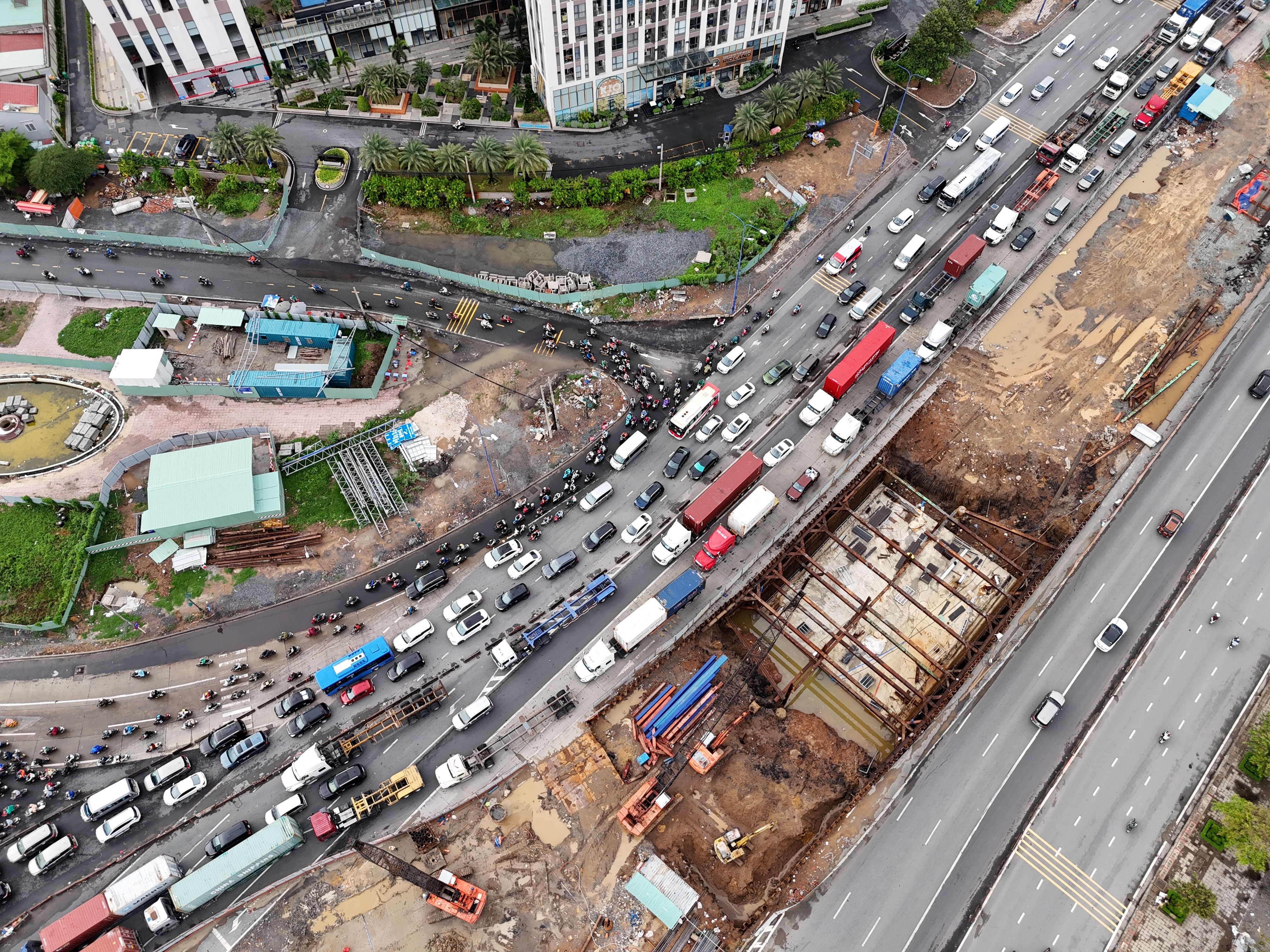 An aerial view of a busy highway with cars and trucks