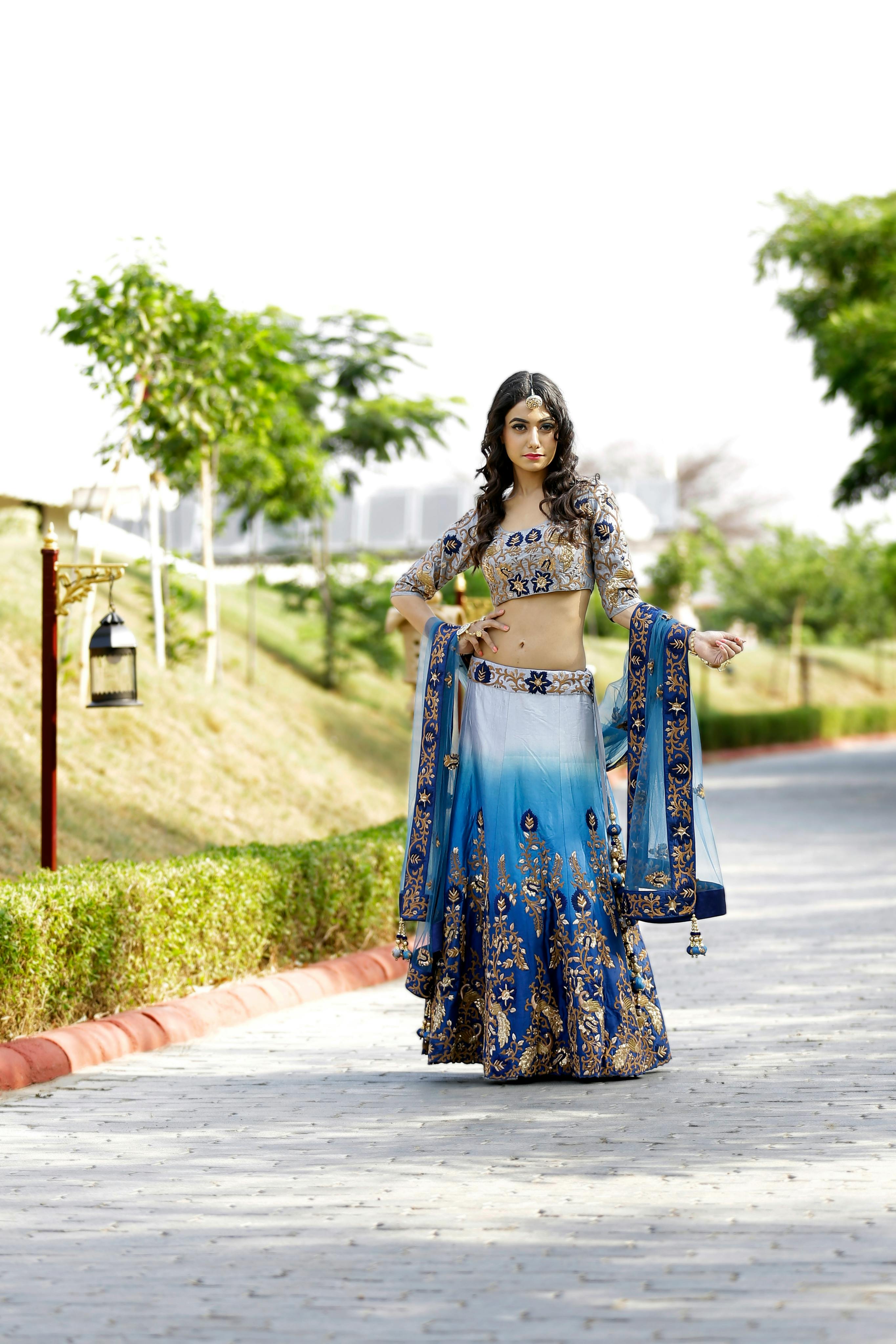 Symmetrical raw silk back motif finished with kundan tassels