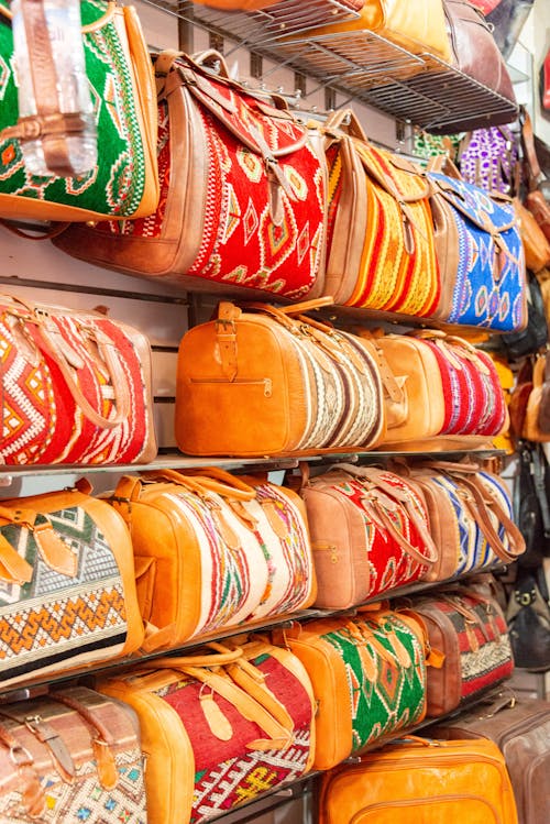 A display of colorful bags on a shelf
