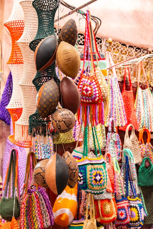 A colorful display of handbags and other items