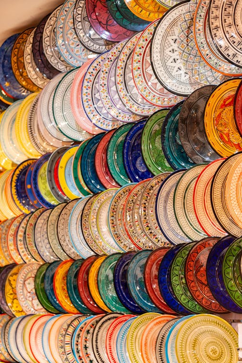A wall of colorful plates and bowls