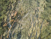 An aerial view of a rocky mountain with trees